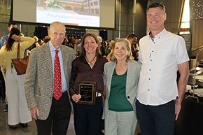 [Endocrinology researcher Jennifer Stern, PhD (center) with her family, including parents, celebrate her receiving a faculty award.]