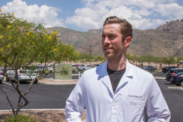 Outside the Banner - University Medicine dermatology clinic on Pima Canyon Drive, Dr. Daniel Butler surveys the Catalina Mountain foothills.