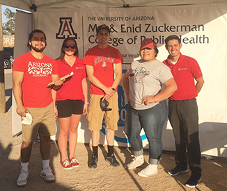 Dr. David Garcia and his Nosotros team doing a community event at the Tanque Verde Swap 