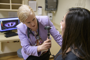 Dr. Julie Bauman examining a patient