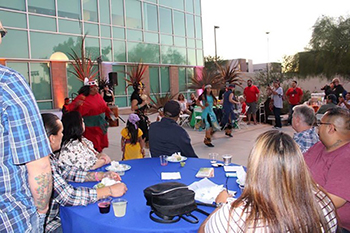 NLAAD Tucson crowd watches native costume dancers.
