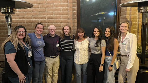 [UArizona Internal Medicine Student Association members with IMSA faculty advisor Amy Sussman, MD (center), at a Post-Match Day celebration at Zinburger in Tucson: Bailey Antonowicz (MS4), Katie Pulling (MS4), Sanjay Menghani (MS4), Lauren Murphy (MS4), Dr. Sussman, Lupita Molina(MS4), Julia Couto (MS4), and Molly Courtright (MS2).]