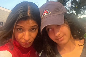 [Dr. Shroff and her daughter before the U of A versus Utah men’s basketball game, Feb. 26, 2025.]