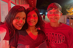 [Dr. Shroff and her daughter and son after the U of A men’s basketball team win over Utah, Feb. 26, 2025.]