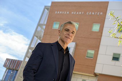 [Physician-scientist Hashem Sadek poses for a photo outside the U of A College of Medicine – Tucson’s Sarver Heart Center.]