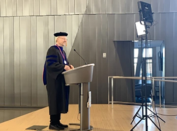 [College of Pharmacy Dean Rick G. Schnellmann, PhD, records his convocation address in the Health Sciences Innovation Building. The video will be used in this year’s virtual ceremony.]