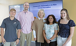 [Initial group of Sun Safety Ambassadors at the UArizona Skin Cancer Institute with Dr. Robin Harris (center)]