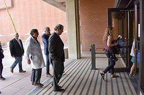 From left, sleep center operations manager Chris Morton, Dr. Michael Abecassis, Dr. Sai Parthasarathy and Dr. Michael Dake walk into UArizona College of Medicine - Tucson building to tour new sleep center.