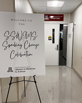 [Signage outside COM-T Social Hall about the 2024 SSWIMS fellow graduation event with the moniker, ‘Sparking Change,” capturing the essence of the evening’s festivities.]