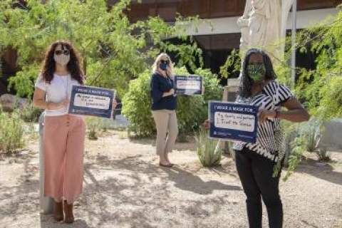 A showing of support for public health protocols from the College of Medicine – Tucson’s Office of Diversity, Equity and Inclusion. From left: Michelle Ortiz, PhD, Rachelle Powell, Victoria Murrain, DO.