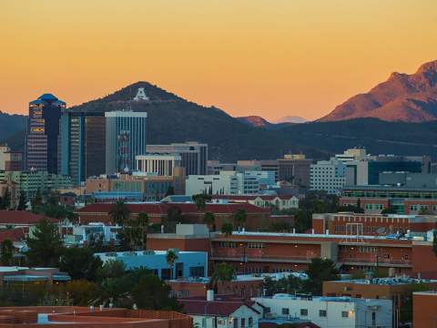 [Sunset image of A Mountain as viewed across the UofA campus and downtown Tucson]