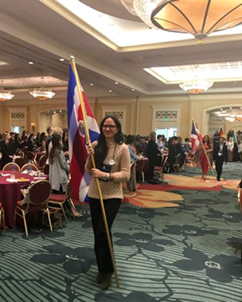 Rosanna Mauro carries Costa Rican flag at IAEDP Symposium