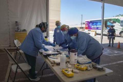[Tuba City Regional Health Care Nurses and doctors working in a tent set up for COVID-19 testing.]