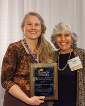 Drs. Monica Vandivort and Mindy Fain with Dr. Vandivort's AAHCM award