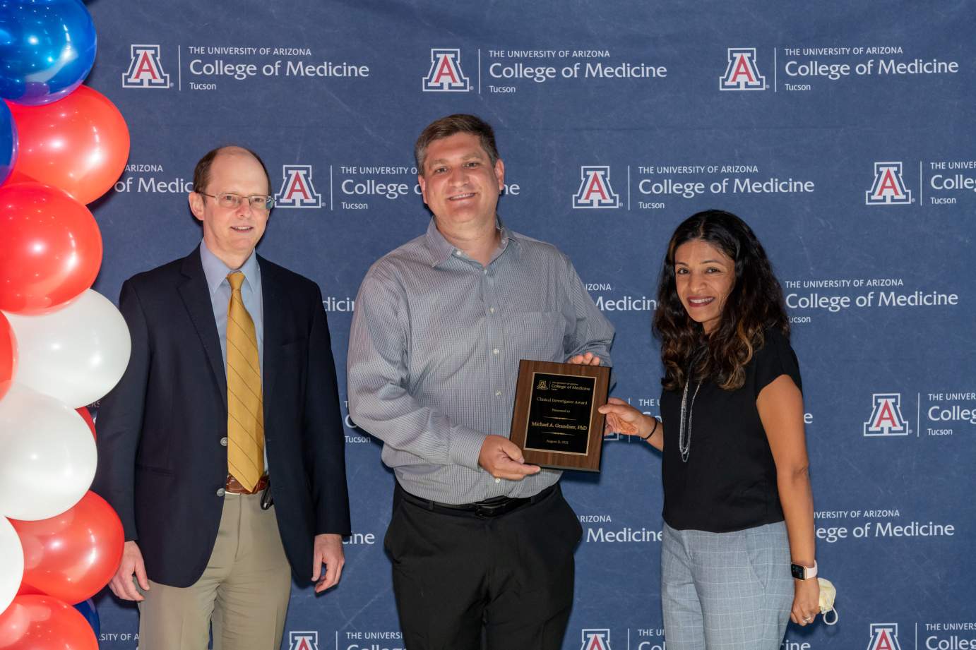 [Dr. Michael Grandner is presented with the Research Excellence Awards by Dr. Jason Wertheim and Dr. Rachna Shroff.]