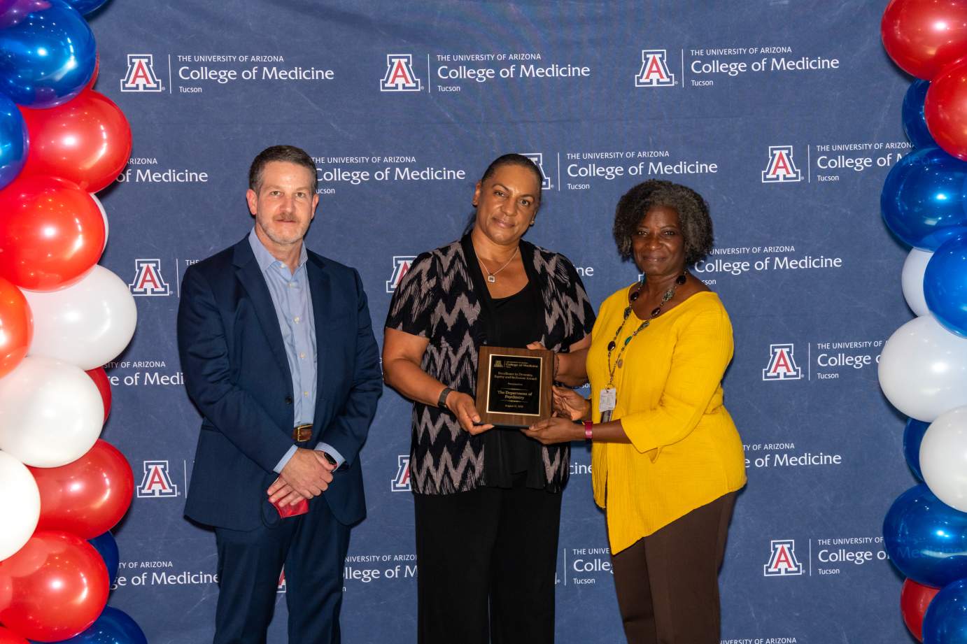 [Dr. Jordan Karp and Dr. Patricia Harrison-Monroe accept the Awards for Excellence in Diversity, Equity, and Inclusion for the Department of Psychiatry presented by Dr. Victoria Murrain.]