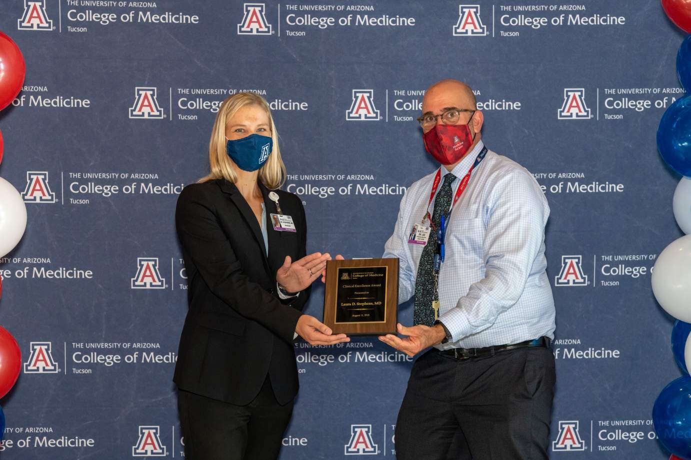   [Dr. Laura Stephens is presented with the Clinical Excellence Award by Dr. Joshua Lee.]