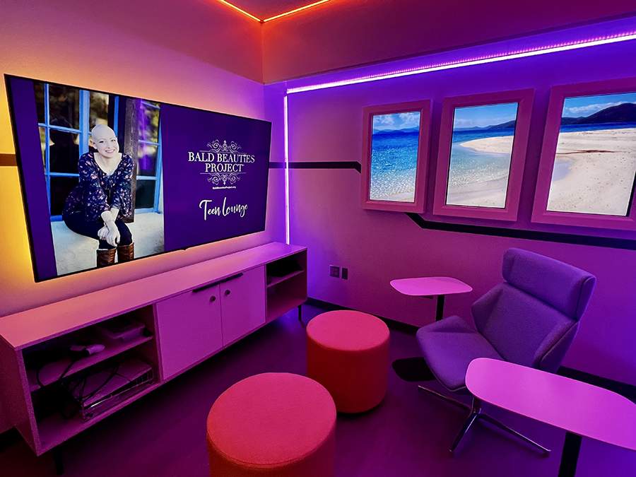 [Image of new respite room for teen oncology patients at the Diamond Children's Center in Tucson, with image on TV screen of former 18-year-old cancer patient to whom the room was dedicated to with funding by her parents]