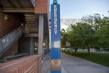 [Blue light emergency phone on the University of Arizona campus.]