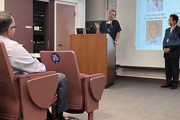 Image of Dr. Mathew Hutchinson, new vice chair for clinical operations, discussing challenges and ways to overcome them to patient access at the invitation of UArizona Department of Medicine Chair Dr. James Liao.