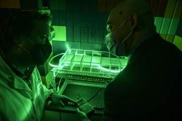 [Researchers studying green light therapy.]