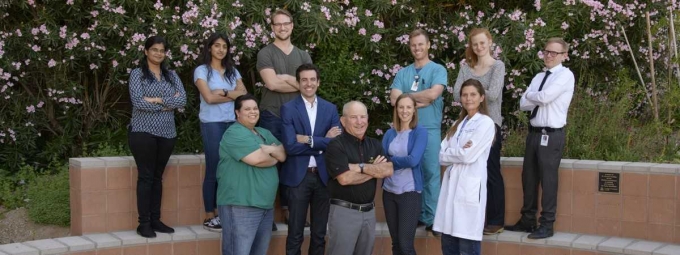 Dr. Steve Goldman, front and center, with members of his lab team and partners with Avery Therapeutics, Drs. Jordan Lancaster and Jen Watson Koevary