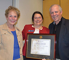 UA President Dr. Robert Robbins presents award to Dr. Nancy Sweitzer