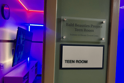 [Image of signage outside the door of the new Diamond Children's respite room for teen oncology patients]