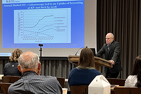 [UArizona gastroenterologist Dr. Josh Melson presents on colorectal cancer screening at the TMC Internal Medicine Grand Rounds in the hospital’s Marshall Auditorium on April 5.]