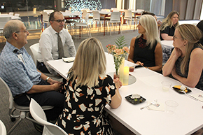 [Drs. Tirdad Zangeneh and Muhammad Al-Obaidi participate with other physicians, including Torchbearer Award nominee Dr. Beth Meyerson, in an exercise during the talk by guest speaker Kim Faith.]