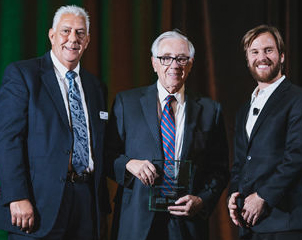 Dr. Ronald S. Weinstein (center) was the winner in the category of Outstanding Outreach.